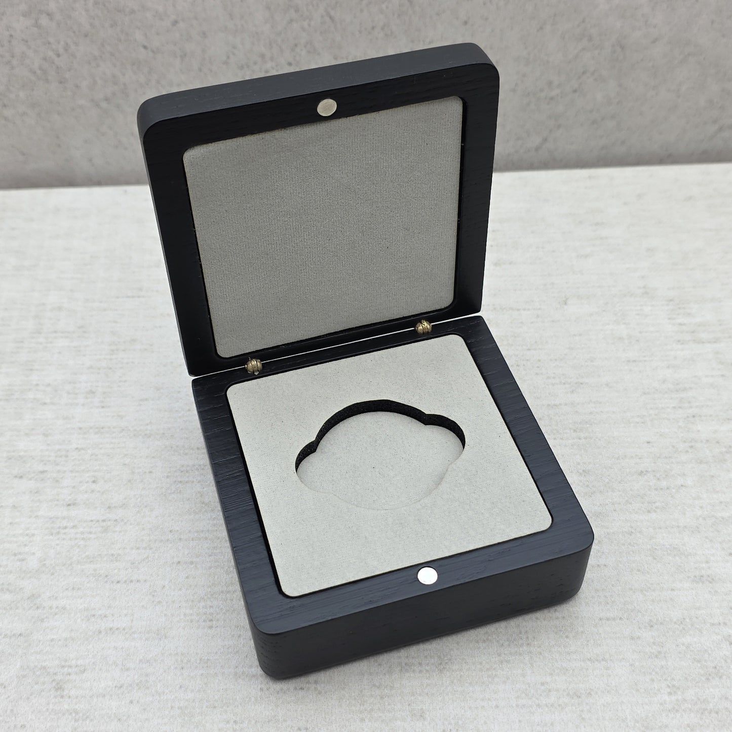 Open black ash wood coin box with premium light gray velvet insert and double side notches, luxury challenge coin display case.