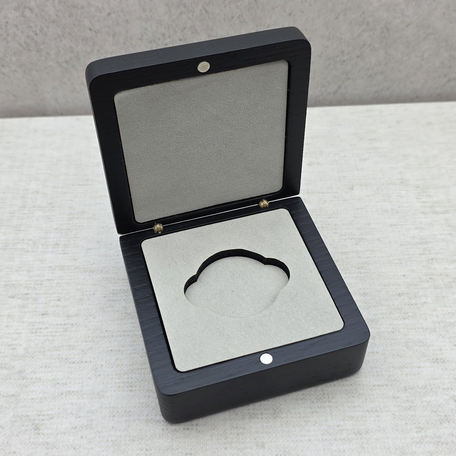 Open black ash wood coin box with premium light gray velvet insert and double side notches, luxury challenge coin display case.