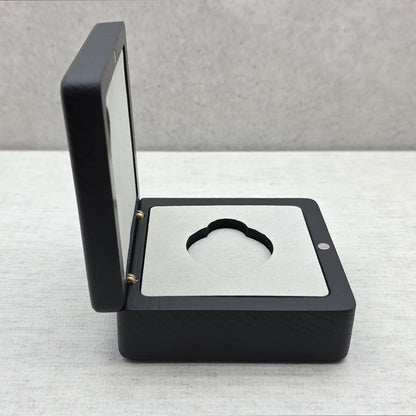 Side view of open black painted wooden challenge coin box made of natural ash wood with elegant light gray velvet lining.