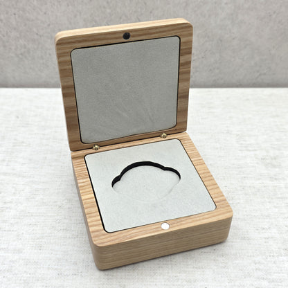 Open natural ash wood coin box with soft light gray velvet insert, elegant presentation case for military coins and medallions.